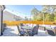 Backyard patio with string lights, seating, and dining area at 2009 Elvington Rd, Johns Island, SC 29455