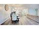 Open concept dining area with large clock and kitchen view at 2009 Elvington Rd, Johns Island, SC 29455