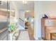 Bright entryway with hardwood floors, piano, and coat rack at 2009 Elvington Rd, Johns Island, SC 29455
