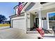 Front view of a two-story house with gray siding and white garage at 2009 Elvington Rd, Johns Island, SC 29455
