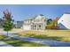 Two-story house with gray siding, white garage door, and landscaped yard at 2009 Elvington Rd, Johns Island, SC 29455