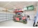 Garage with golf cart, storage, and overhead shelving at 2009 Elvington Rd, Johns Island, SC 29455