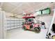 Garage with golf cart, storage, and overhead shelving at 2009 Elvington Rd, Johns Island, SC 29455