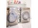 Modern laundry room with stacked washer and dryer at 2009 Elvington Rd, Johns Island, SC 29455