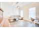 Living room with sectional sofa, coffee table, and hardwood floors at 2009 Elvington Rd, Johns Island, SC 29455