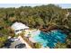 Community pool with cabana and surrounding trees at 2009 Elvington Rd, Johns Island, SC 29455