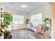 Bright sunroom featuring hardwood floors, large windows, and comfortable seating at 2009 Elvington Rd, Johns Island, SC 29455