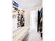 Bright walk-in closet with custom built-ins and a bench at 2009 Elvington Rd, Johns Island, SC 29455
