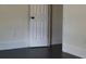 Simple bedroom with dark hardwood floors and a white door at 203 Padgett Loop, Walterboro,  29488