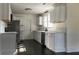 Modern kitchen with white cabinets and dark hardwood floors at 203 Padgett Loop, Walterboro,  29488