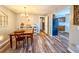 Cozy dining area with hardwood floors and a view into the kitchen at 2107 Presidio Dr, Mount Pleasant,  29466