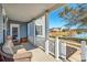 Covered porch overlooking a pond with wicker furniture at 224 Berwick Dr, Summerville,  29483