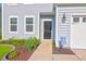Front door with walkway and landscaping at 225 Sugarberry Ln, Moncks Corner, SC 29461