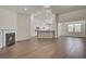 Open living room with hardwood floors, fireplace, and kitchen views at 245 Pine Crest View Dr, Summerville,  29486