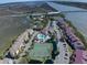 Aerial view of community, tennis courts, and pools at 30 Mariners Cay Dr, Folly Beach, SC 29439