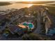 Aerial view of community showing pools, tennis courts, and waterway access at 30 Mariners Cay Dr, Folly Beach, SC 29439
