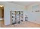 Bedroom with storage shelving and art at 30 Mariners Cay Dr, Folly Beach, SC 29439