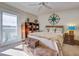 Bedroom with balcony access, dresser, and wicker decor at 30 Mariners Cay Dr, Folly Beach, SC 29439