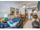 Spacious living room features a leather sofa and opens to dining area at 30 Mariners Cay Dr, Folly Beach, SC 29439