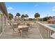 Relaxing community patio overlooking pool and tennis courts at 30 Mariners Cay Dr, Folly Beach, SC 29439