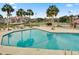 Inviting community pool with lounge chairs and tennis courts in the background at 30 Mariners Cay Dr, Folly Beach,  29439