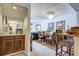 Small wet bar with wood cabinets and a sink, adjacent to dining area at 30 Mariners Cay Dr, Folly Beach, SC 29439