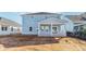 Rear exterior of a light blue two-story home with covered porch at 314 Calm Water Way, Summerville, SC 29486