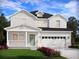 Two-story house with light-grey siding, green door, and attached garage at 315 Calm Water Way, Summerville,  29486