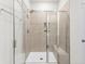 Bathroom with a large shower, a built-in bench, and neutral-toned tile at 316 Calm Water Way, Summerville, SC 29486