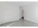 Empty bedroom with white walls, gray carpet, and two white doors at 316 Calm Water Way, Summerville, SC 29486