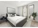 Guest bedroom with a gray platform bed, neutral color scheme, and a large mirror at 316 Calm Water Way, Summerville, SC 29486
