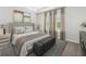 Main bedroom with a plush bed, gray accents, and ample natural light at 316 Calm Water Way, Summerville, SC 29486