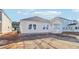 New construction home with a covered front porch and a dirt yard at 316 Calm Water Way, Summerville, SC 29486