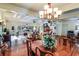 Elegant dining room with a chandelier, offering views of the living room at 4415 Lord Proprietors Rd, Hollywood, SC 29449