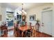 Formal dining room with hardwood floors, a chandelier, and large windows at 4415 Lord Proprietors Rd, Hollywood, SC 29449