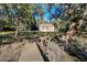 Wooden dock leading to waterfront home and marsh at 4415 Lord Proprietors Rd, Hollywood, SC 29449