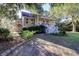 Two-story home with a wrap-around porch and landscaped yard at 4415 Lord Proprietors Rd, Hollywood, SC 29449