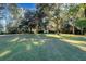 Beautiful home nestled on a spacious lot with mature trees and lush lawn at 4415 Lord Proprietors Rd, Hollywood, SC 29449