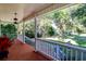 Spacious front porch with rocking chairs and scenic backyard view at 4415 Lord Proprietors Rd, Hollywood, SC 29449