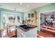 Kitchen with an island, stainless steel appliances, and view into living room at 4415 Lord Proprietors Rd, Hollywood, SC 29449