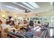 Spacious living area with hardwood floors, ample seating, and access to a deck at 4415 Lord Proprietors Rd, Hollywood, SC 29449