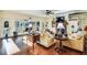 Bright living room with hardwood floors, comfy seating, and large windows at 4415 Lord Proprietors Rd, Hollywood, SC 29449