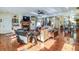 Spacious living room with hardwood floors, fireplace, and ample natural light at 4415 Lord Proprietors Rd, Hollywood, SC 29449