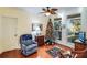 Cozy office space with hardwood floors, comfortable seating, and a Christmas tree at 4415 Lord Proprietors Rd, Hollywood, SC 29449