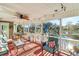 Relaxing screened porch overlooking the pool and waterfront views at 4415 Lord Proprietors Rd, Hollywood, SC 29449