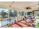 Large screened porch with comfortable seating and scenic backyard views at 4415 Lord Proprietors Rd, Hollywood, SC 29449