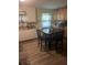 Eat-in kitchen with light wood cabinets and tile floor at 4450 Hardwood St, Ladson, SC 29456