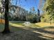 Serene backyard pond with fountain and lush landscaping at 4600 Palm View Cir, North Charleston,  29418