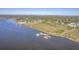 Aerial view of waterfront property with private dock and boats at 4629 Bonnie Marie Way, North Charleston,  29405