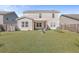 Large backyard with home, grass, and raised garden beds at 488 Sanctuary Park Dr, Summerville, SC 29486